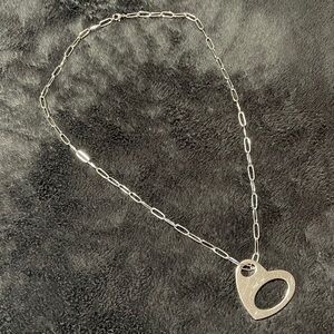 Bliss INOX Silver Heart.
Stainless Steel with Small Diamond. 
Durable + Heavy.